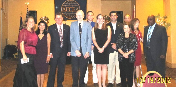 New officers and committee chairs installed at the October banquet include (l-r) Heidi Hughes, regional vice president; Minerva Stern, vice president for sponsor activities; Dan Steele, chapter president; J.P. (Andy) Anderson, publicity chair; Dan Griffith, registration chair; Lt. Col. April Cantwell, USAF, vice president; Marc Howarth, treasurer; Sheryl Glore, director; Harvey Kay, director; Catherine McCarthy, vice president for membership; and Leon Fenn, vice president for programs. Not present was Trish Voycheske, secretary.